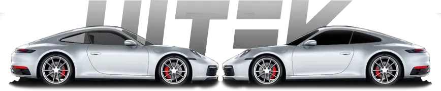 Two silver Porsche cars with red brakes, facing each other. Grey letters behind the cars.