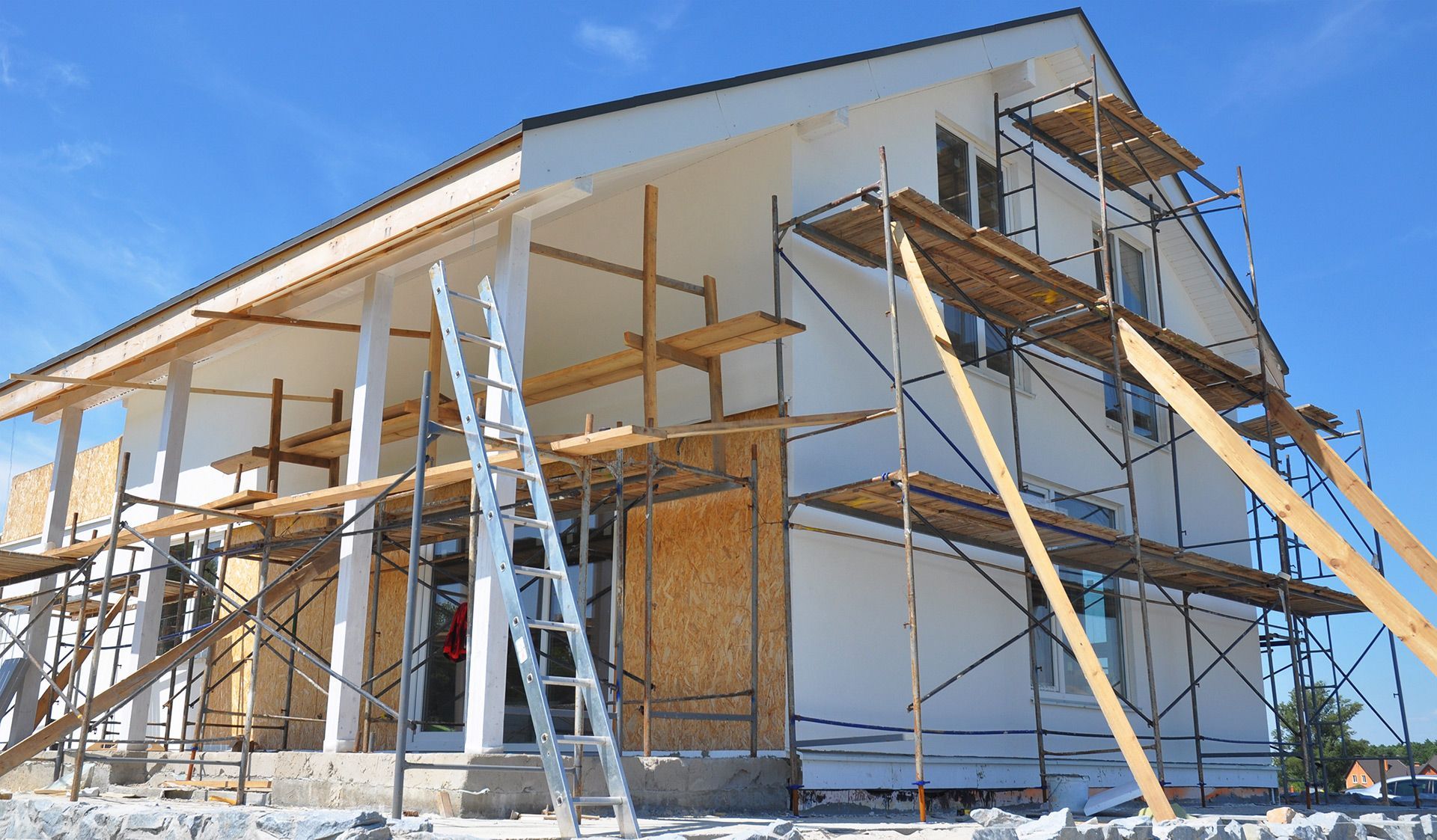 A house is being built with scaffolding around it.
