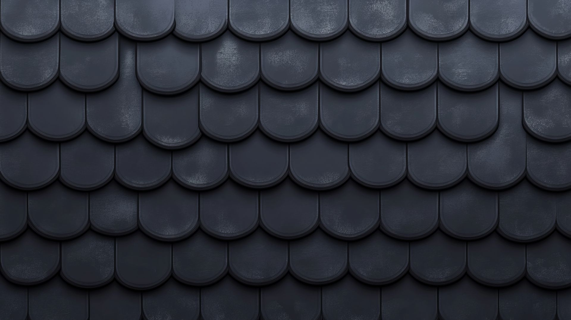 Un gros plan d'une texture de tuile de toit noire.