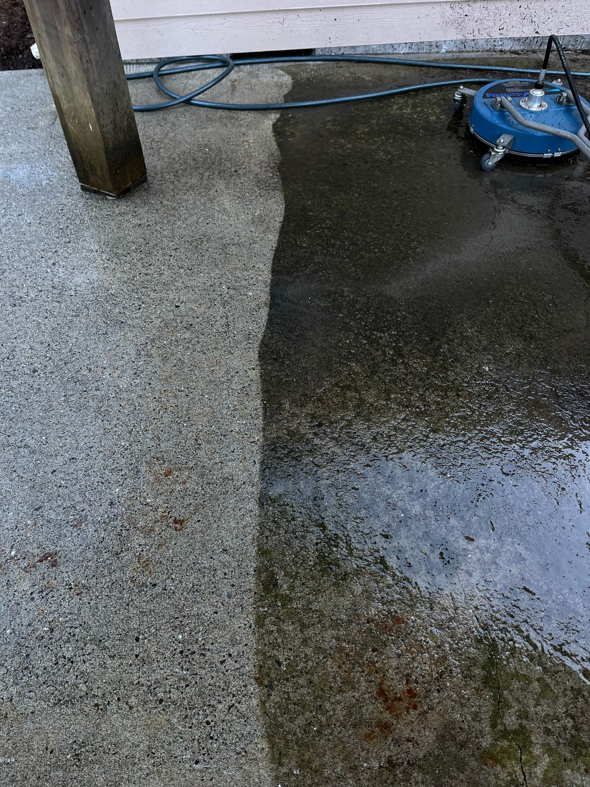 A before and after picture of a concrete floor being cleaned with a machine.