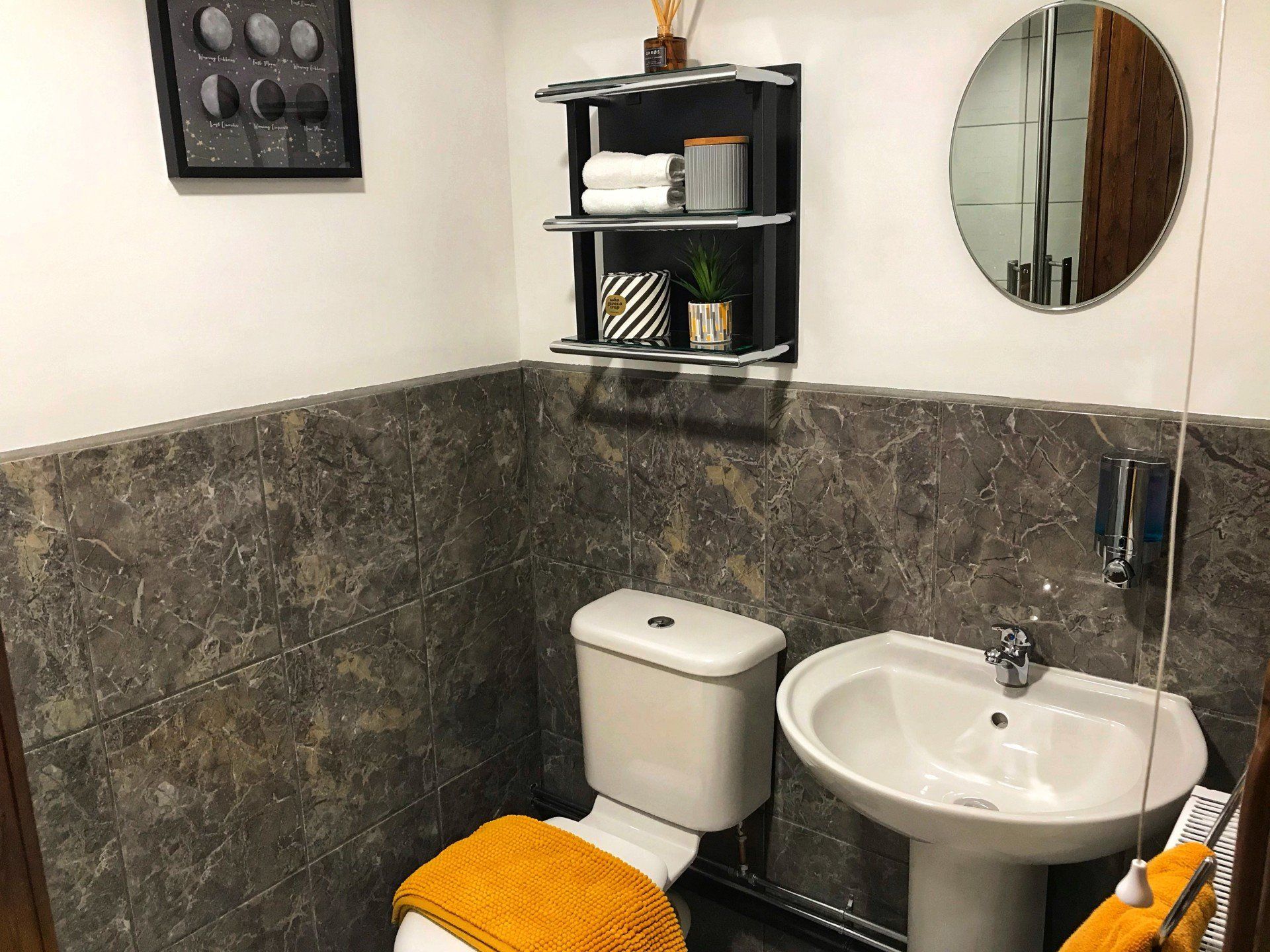 Modern en-suite with mustard yellow accessories