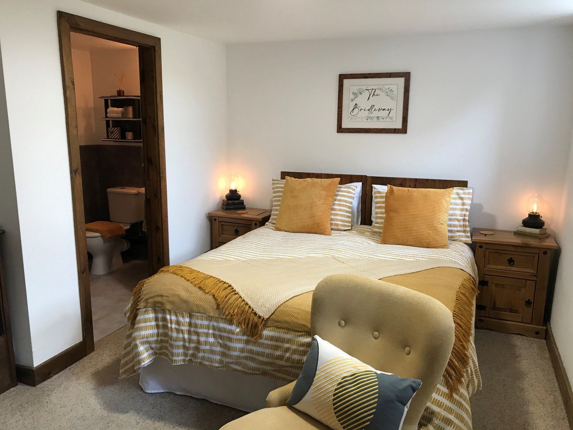 Comfy Double bed with yellow and grey bedspread