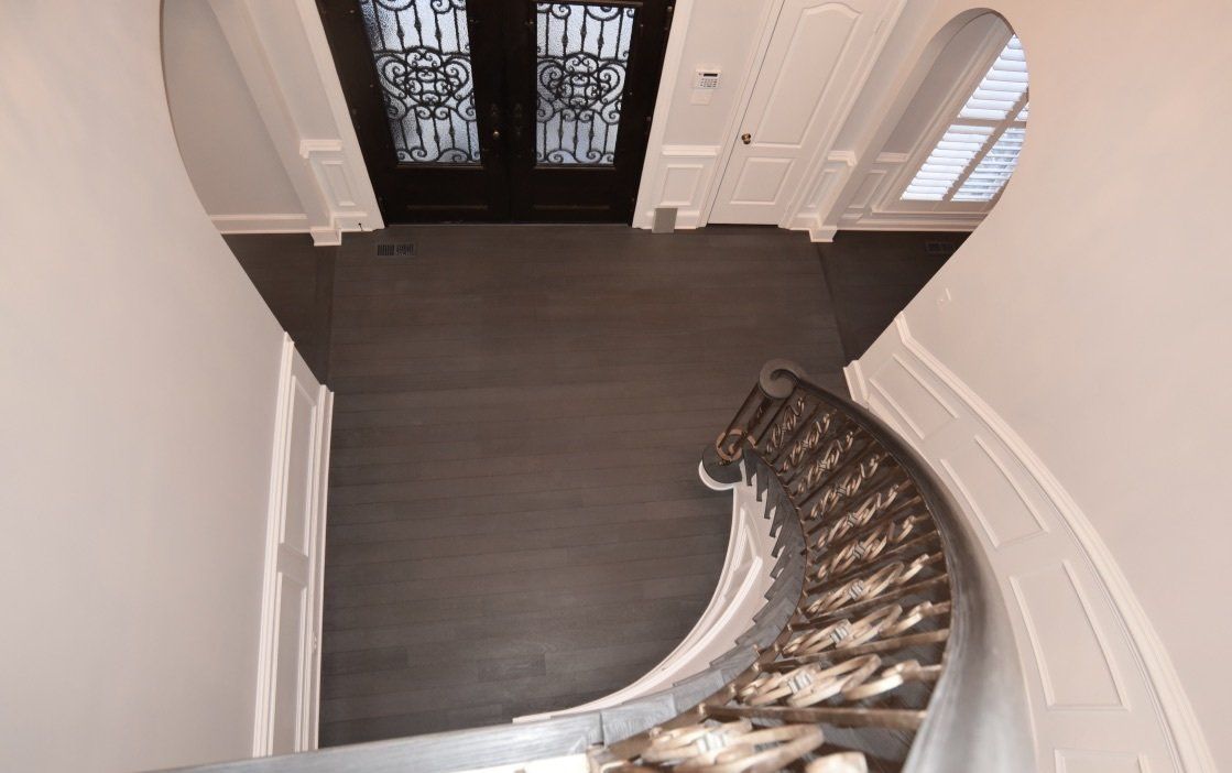 An aerial view of a curved staircase in a house