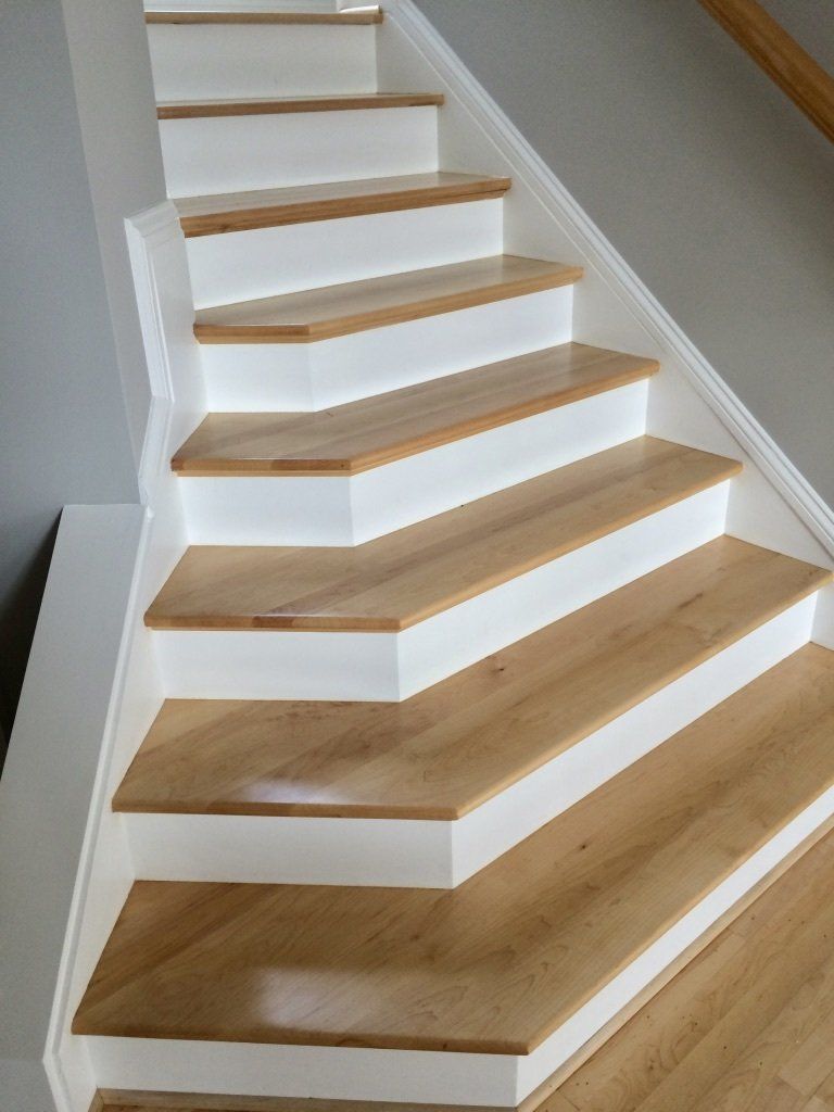 A staircase with wooden steps and white risers