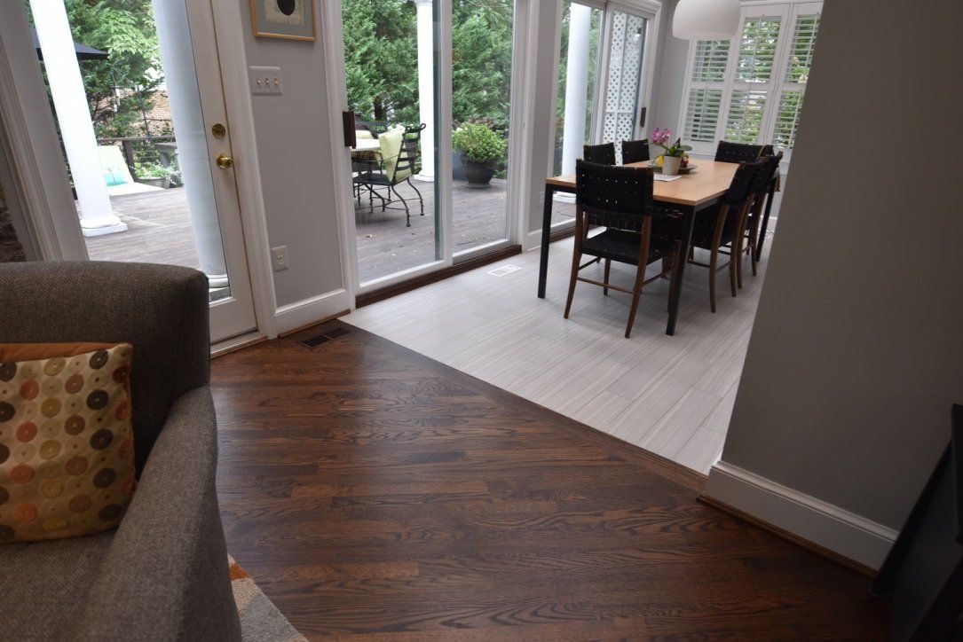 A living room with a dining room table and chairs