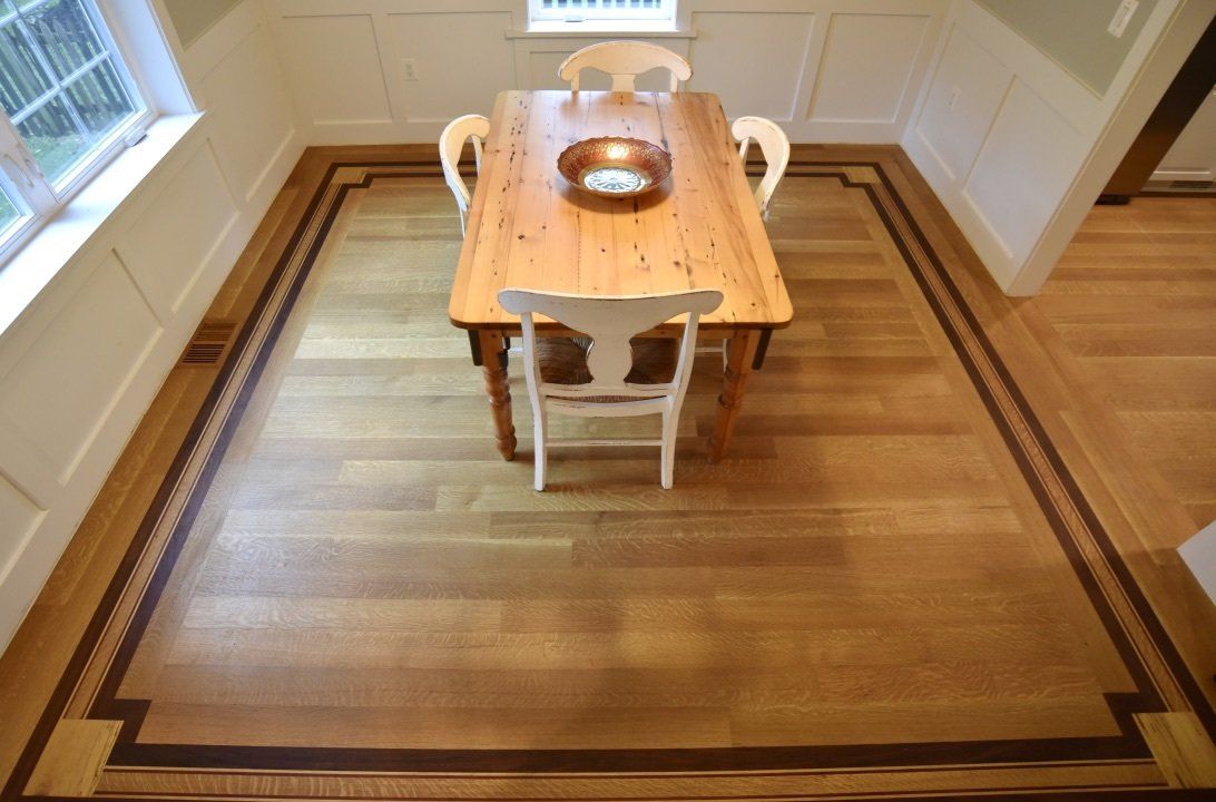 A dining room table with a bowl on top of it