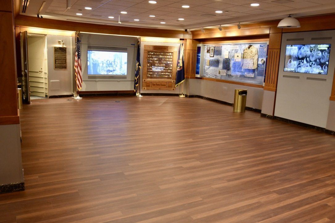 A large empty room with a wooden floor