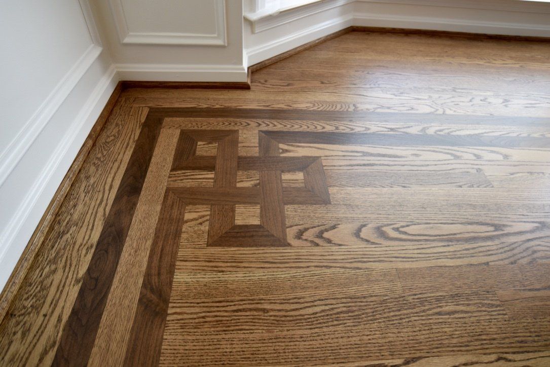 A wooden floor with a geometric pattern on it