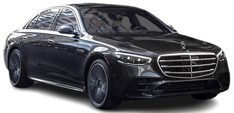 Black Mercedes-Benz sedan, angled slightly, with chrome grill and black wheels, set against white.