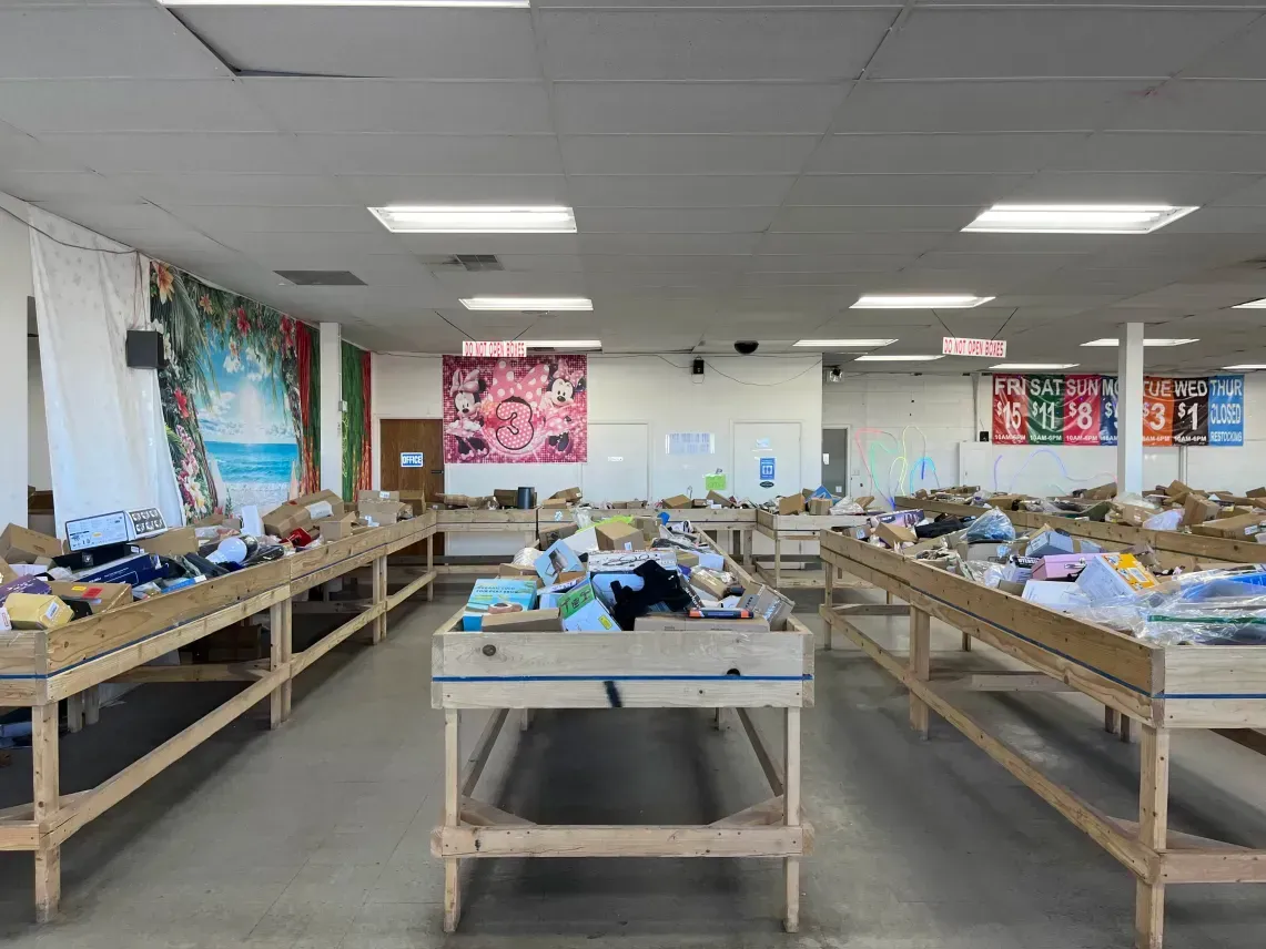 Discount merchandise bins inside Super Sale Bin Store