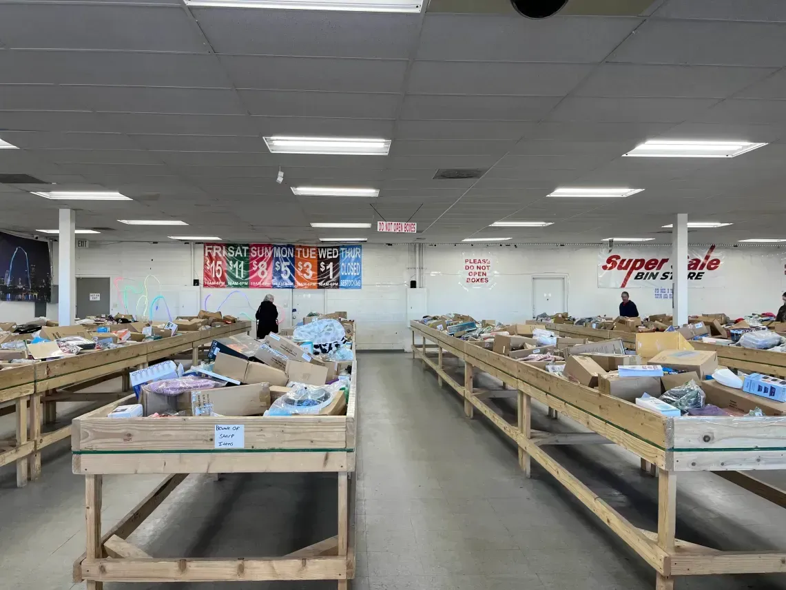 Customers shopping bins at Super Sale Bin Store in Pueblo, Colorado
