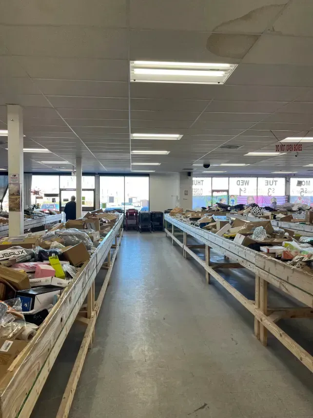 Customers shopping liquidation bins in Pueblo, Colorado