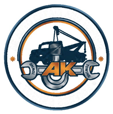 Logo for AK Towing: tow truck silhouette with wrench over 
