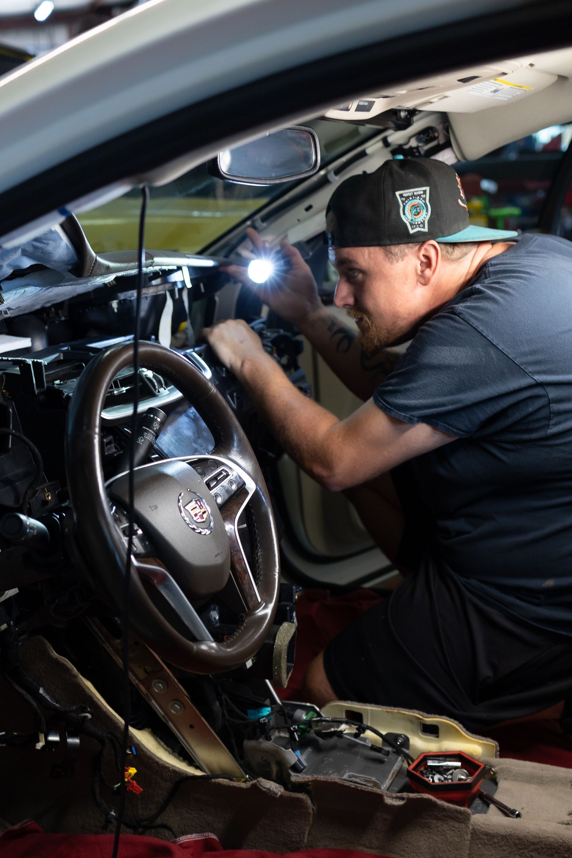 Mechanic Working on the Engine of a Truck | Parker's Tire & Auto Service