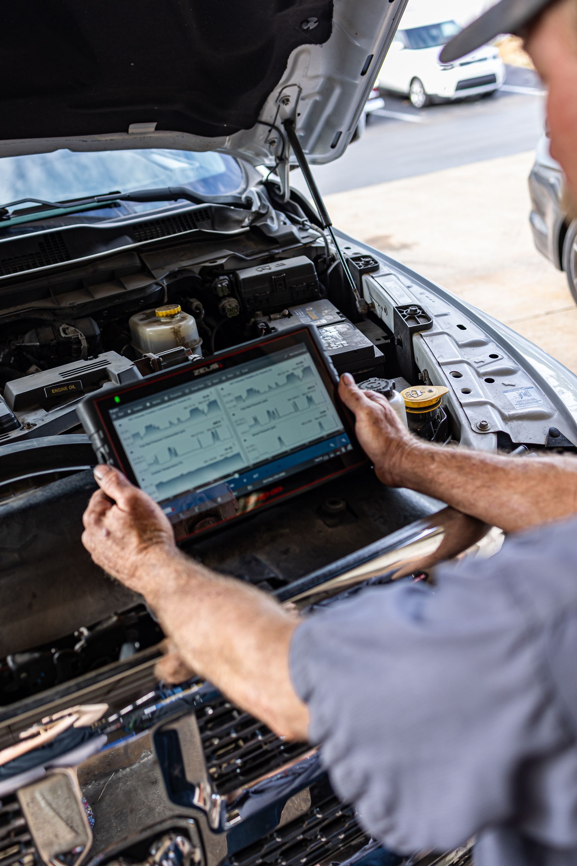 Mechanic Diagnosing a Car Engine | Parker's Tire & Auto Service