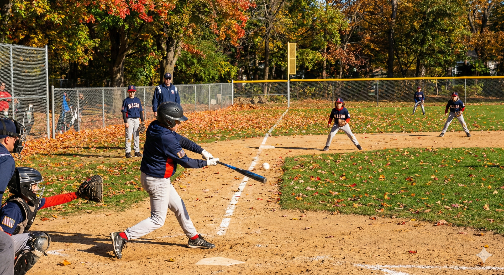 Baseball on a dark surface, with visible stitching.
