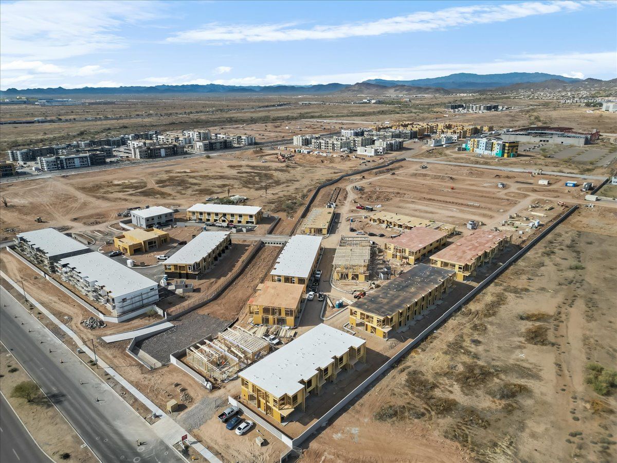 An aerial view of a building under construction in the desert.