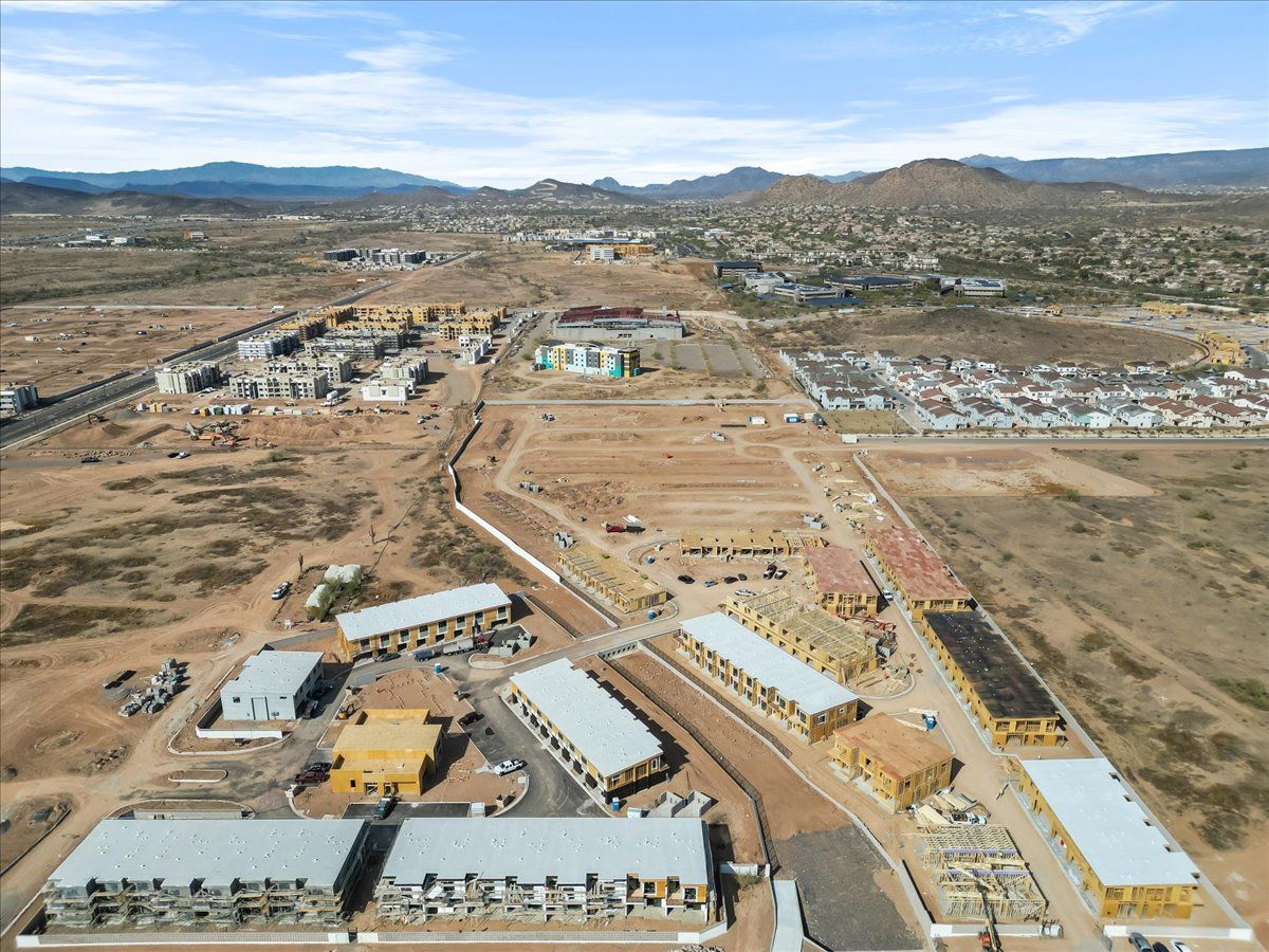 An aerial view of a building under construction in the desert.