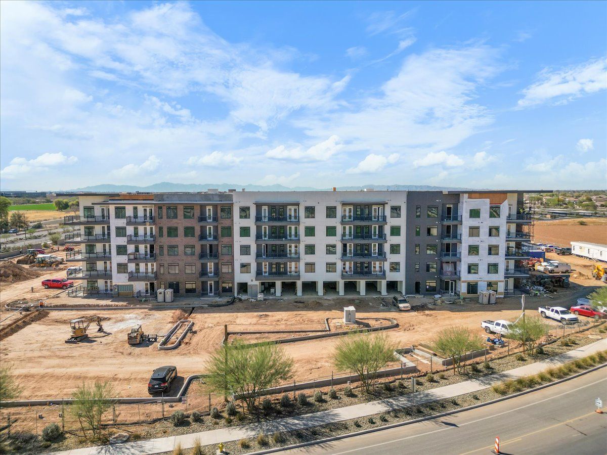 An aerial view of a large apartment building under construction.