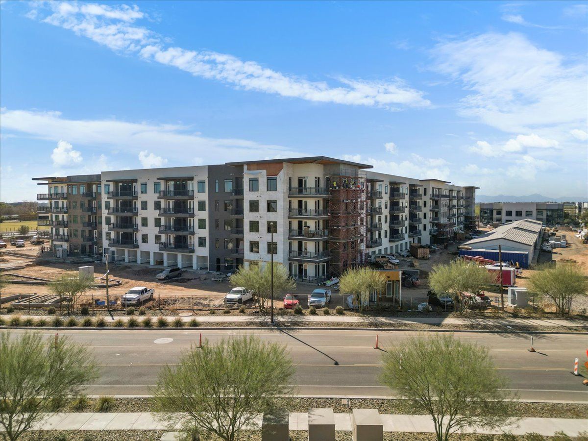 An aerial view of a large apartment building under construction.