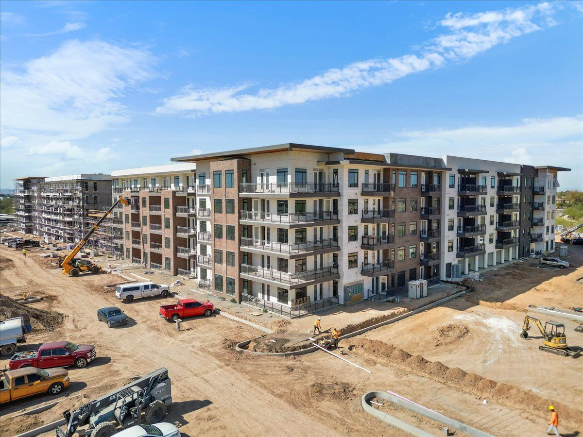 An aerial view of a large apartment building under construction.
