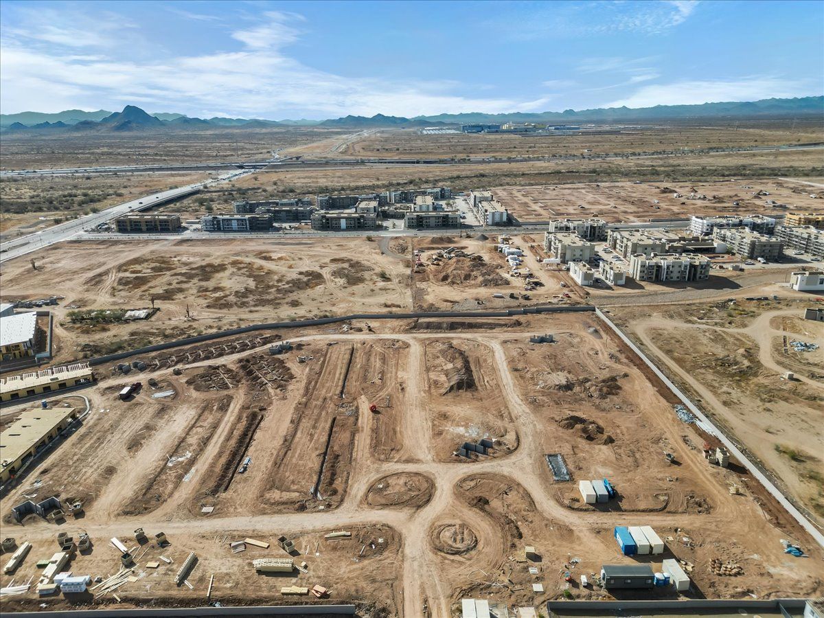 An aerial view of a large construction site in the desert.
