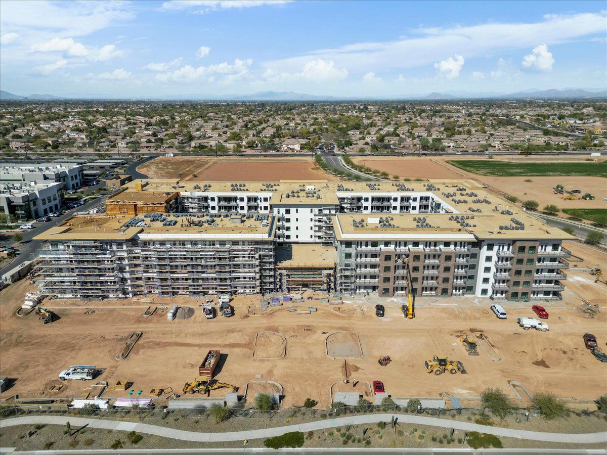 An aerial view of a large building under construction in the desert.