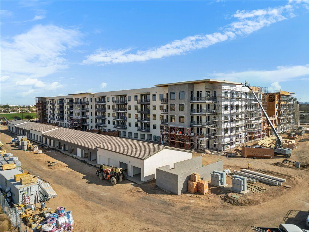 An aerial view of a large apartment building under construction.