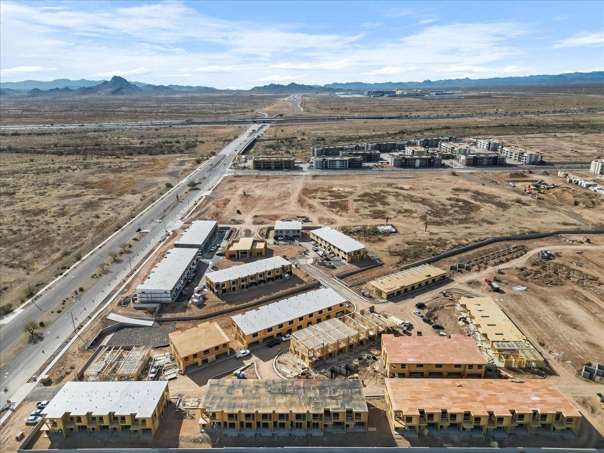 An aerial view of a building under construction in the desert.