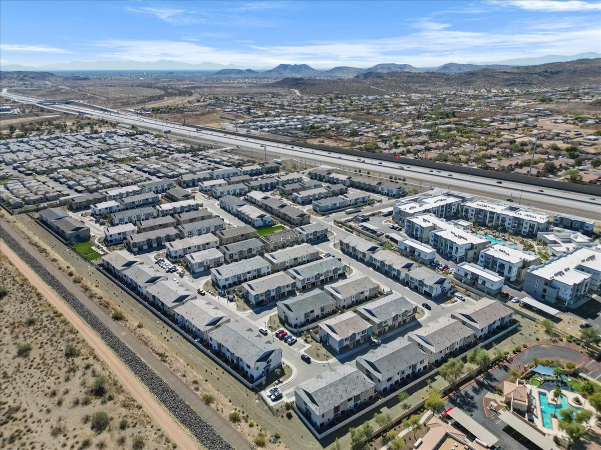 An aerial view of a large apartment complex in the desert.