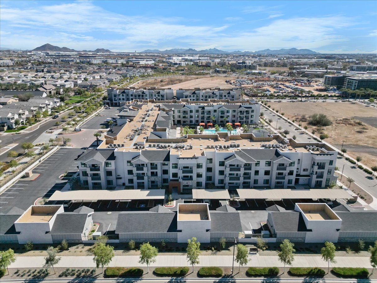 An aerial view of a large apartment complex in a city