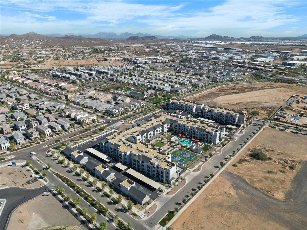 An aerial view of a city with mountains in the background