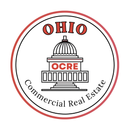 Real estate logo: Black building and red roof within a red crescent.