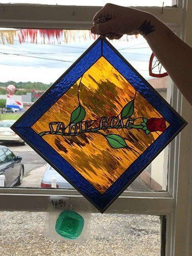 Stained glass artwork of a rose with