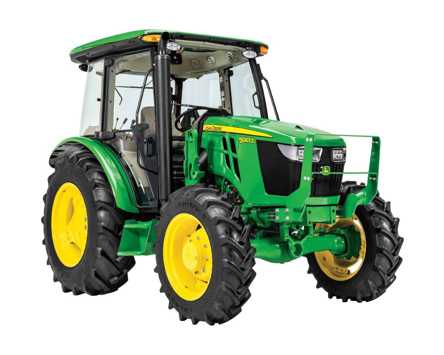 A retail aisle filled with John Deere parts and supplies, featuring green branded packaging and tractor model displays.