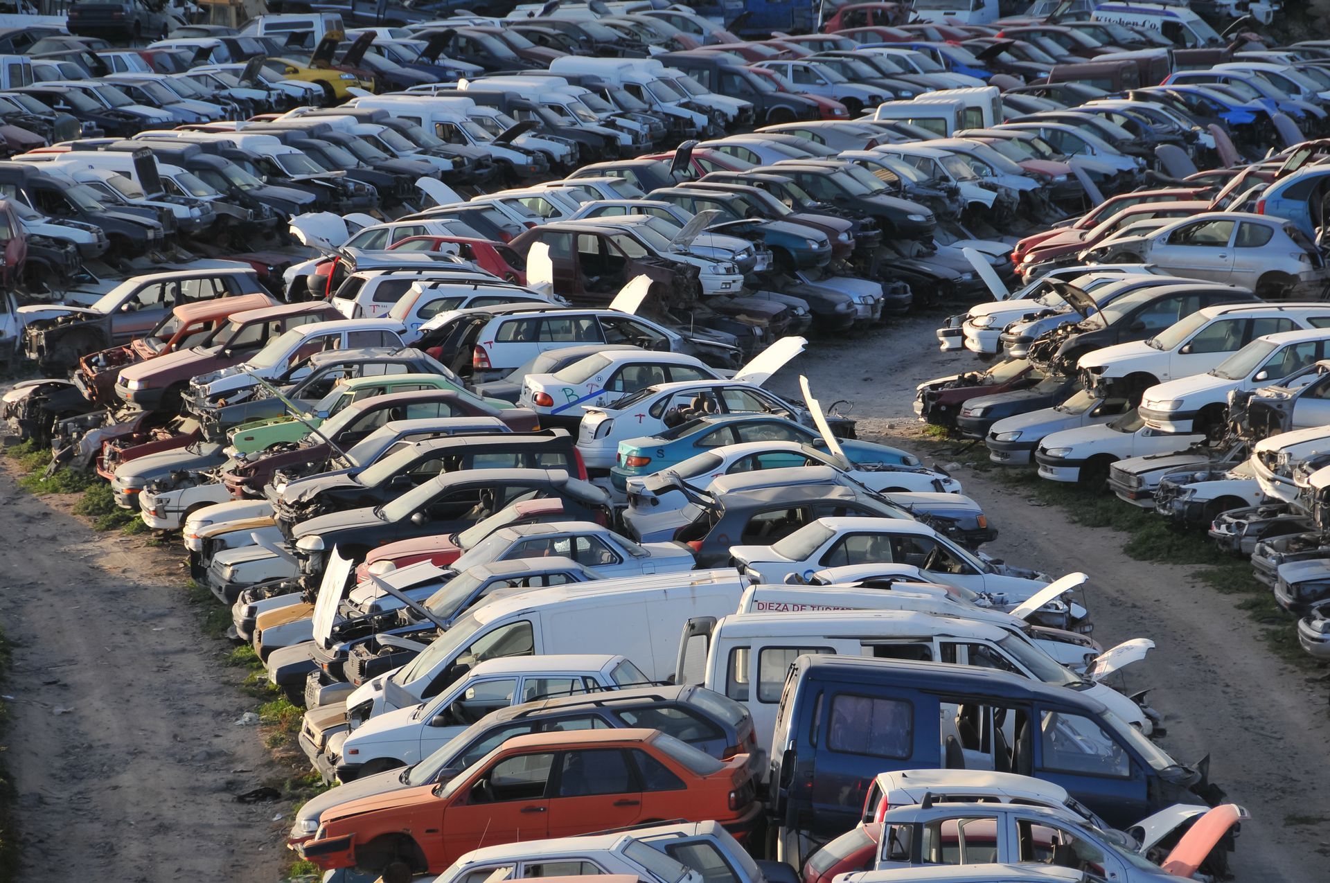 Aerial view of wrecked cars stacked at Edison Automotive junkyard in Columbus, OH