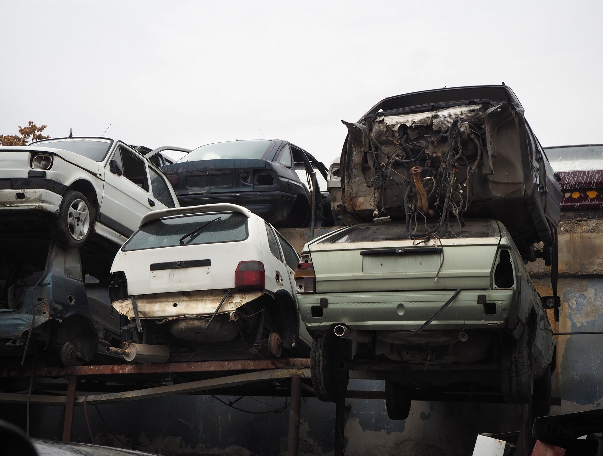 Scrap vehicles heap in the junk yard.
