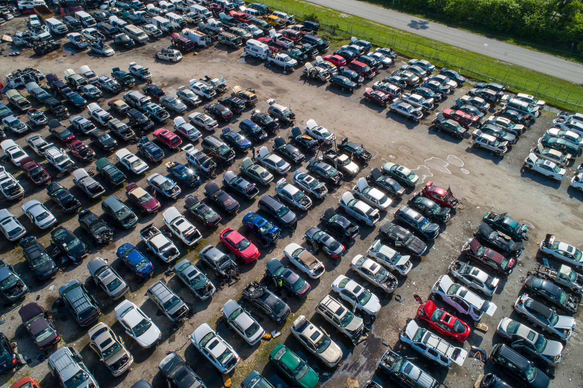Aerial drone photo of a car junk yard.