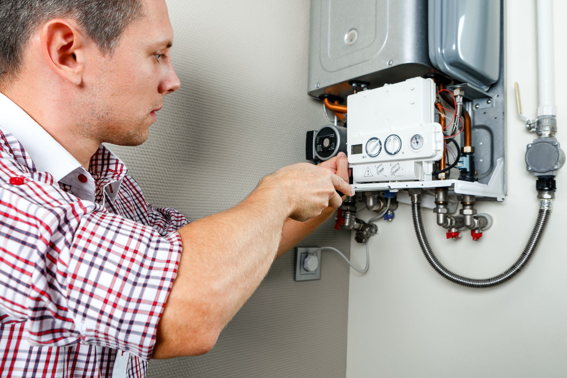 plumber fixing hot water heater