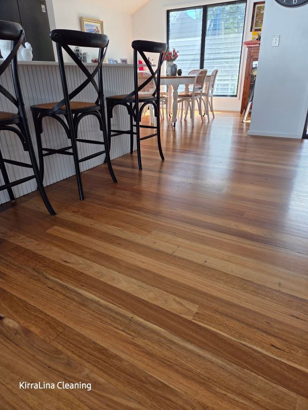 Wooden Floor in A Well-Lit Room with Bar Stools in The Foreground — KirraLina Cleaning Services in Tweed Heads, NSW