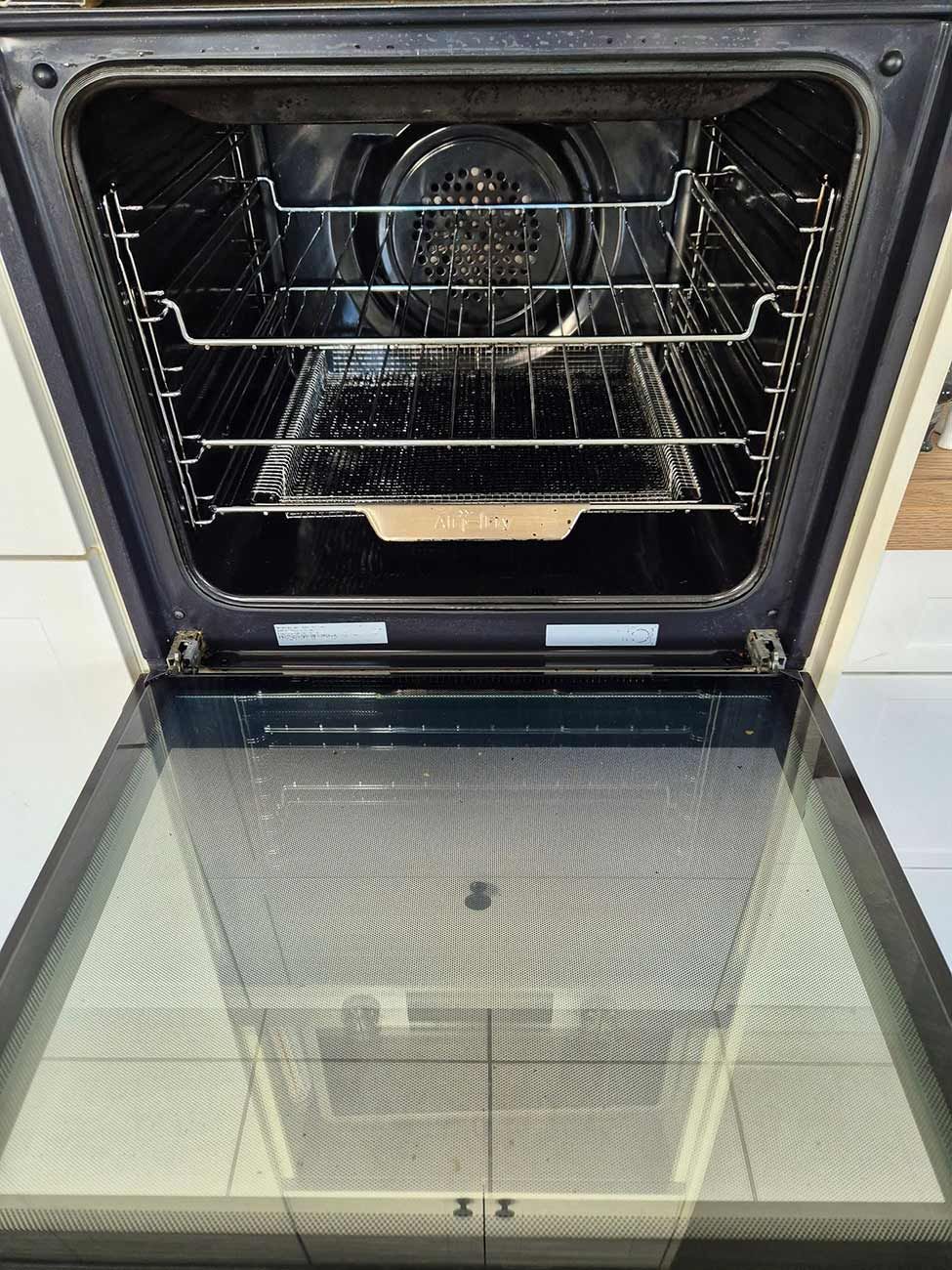 An Open Oven with Glass Door, Empty Interior — KirraLina Cleaning Services in Tweed Heads, NSW