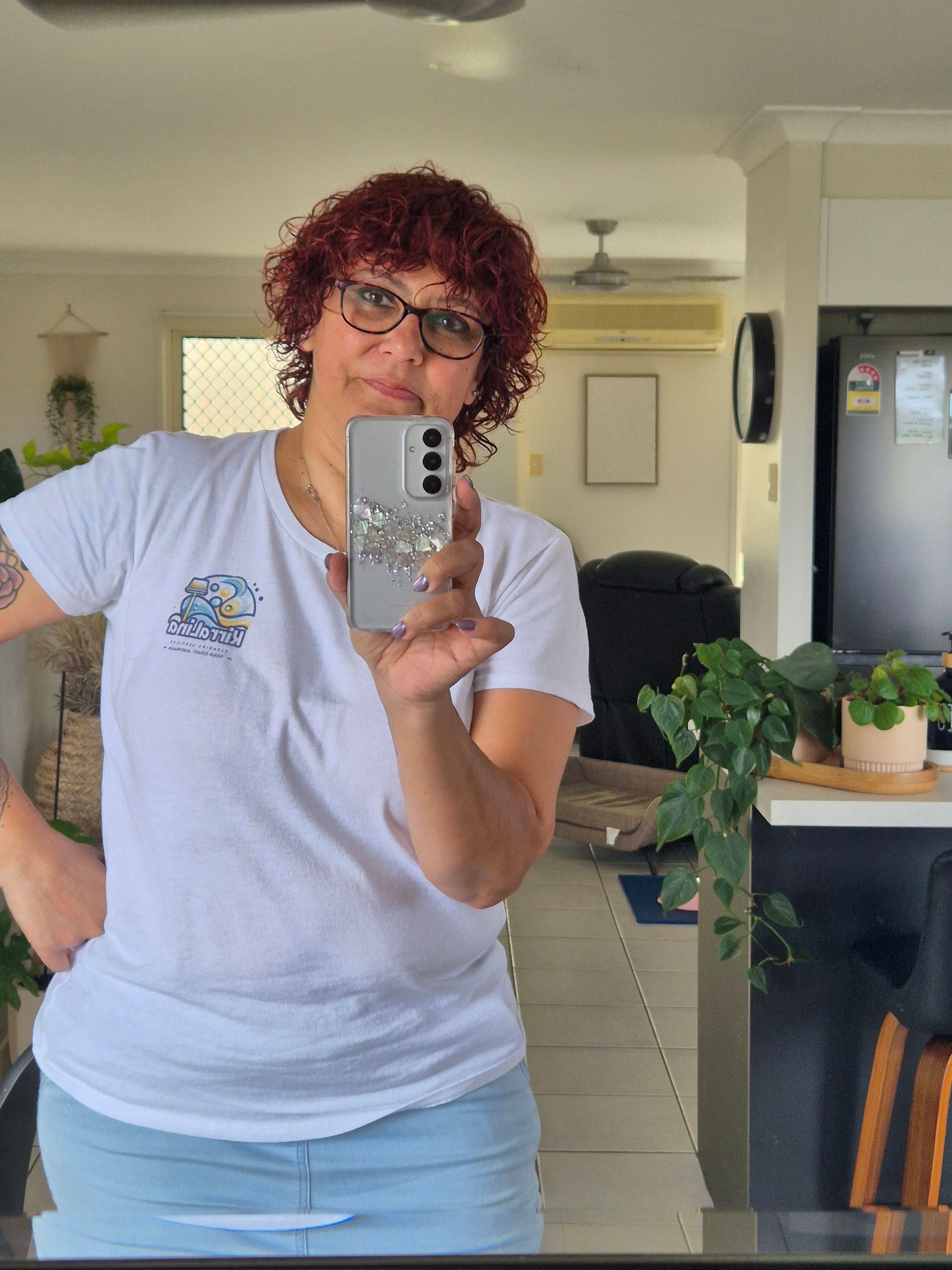 A Woman Wearing Glasses and A White T-Shirt with The Word Brillo on It — KirraLina Cleaning Services in Tweed Heads, NSW