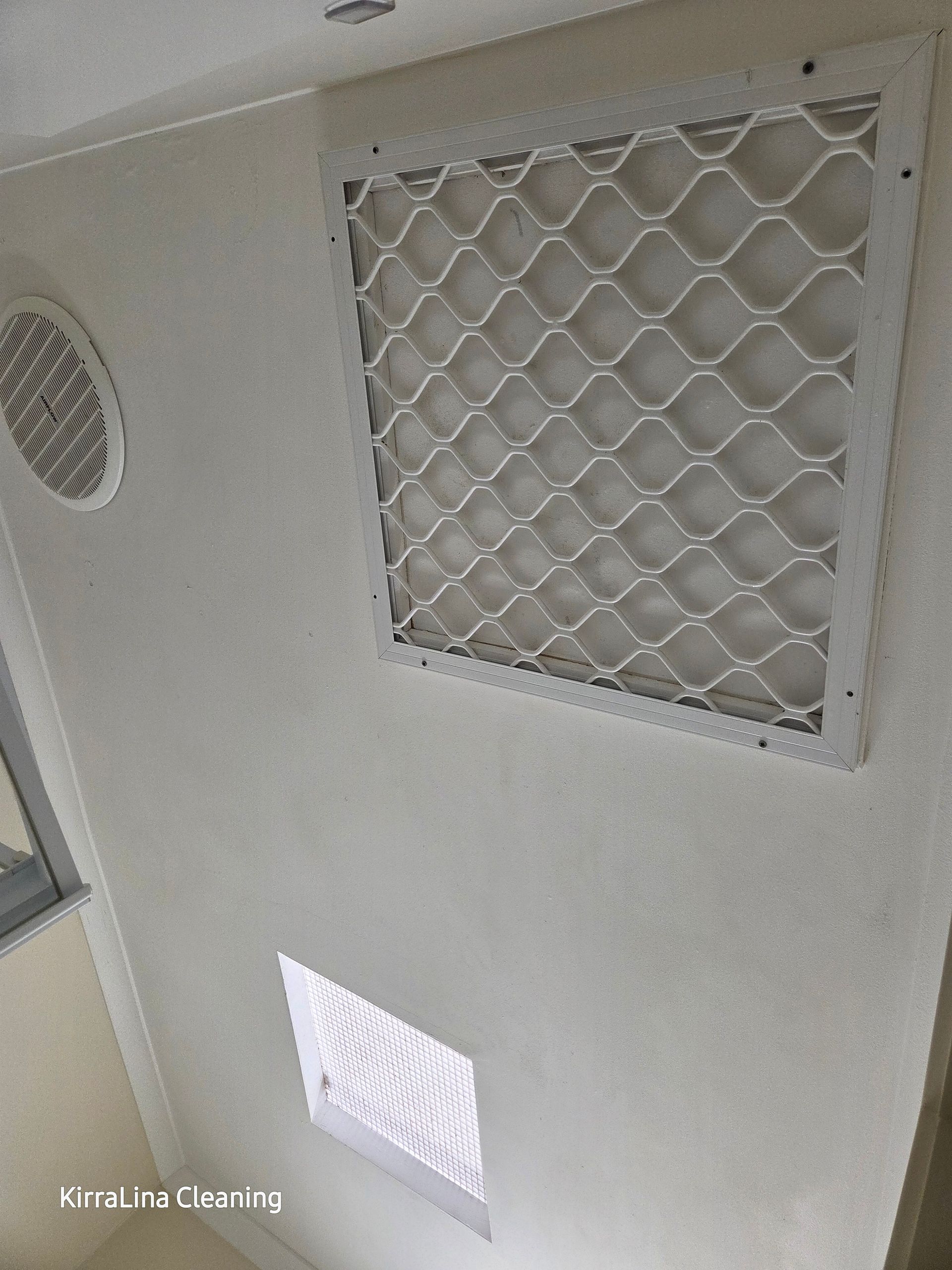 Ceiling view showing a white square ventilation grille, a round vent cover, and a small skylight — KirraLina Cleaning Services in Tweed Heads, NSW