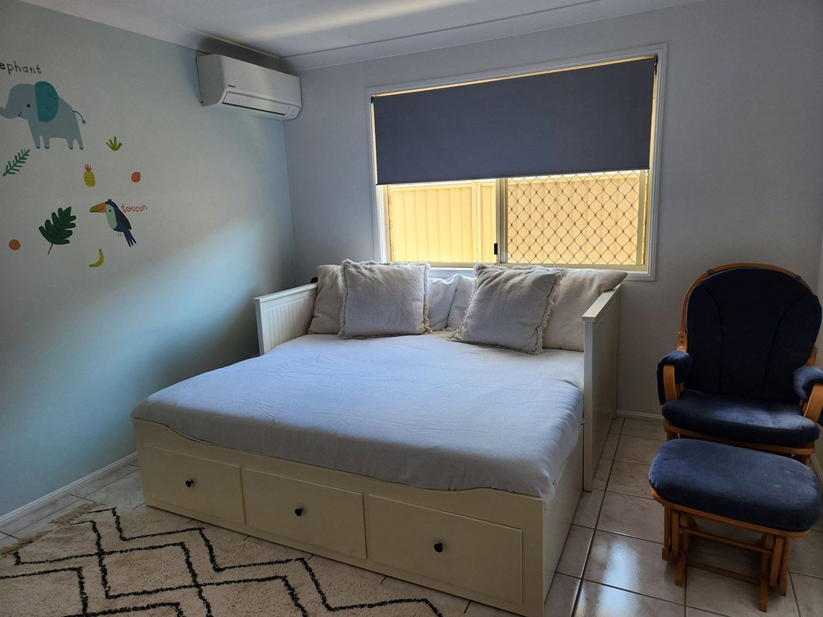 Bedroom with A Daybed, Blue Rocking Chair — KirraLina Cleaning Services in Tweed Heads, NSW