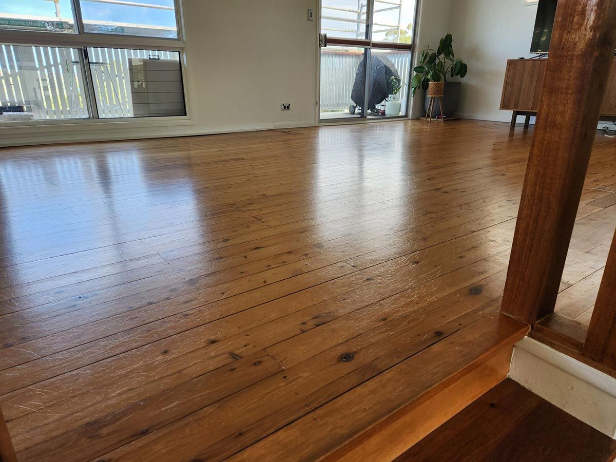 Polished Wooden Floor in A Living Room, Reflecting Sunlight — KirraLina Cleaning Services in Tweed Heads, NSW