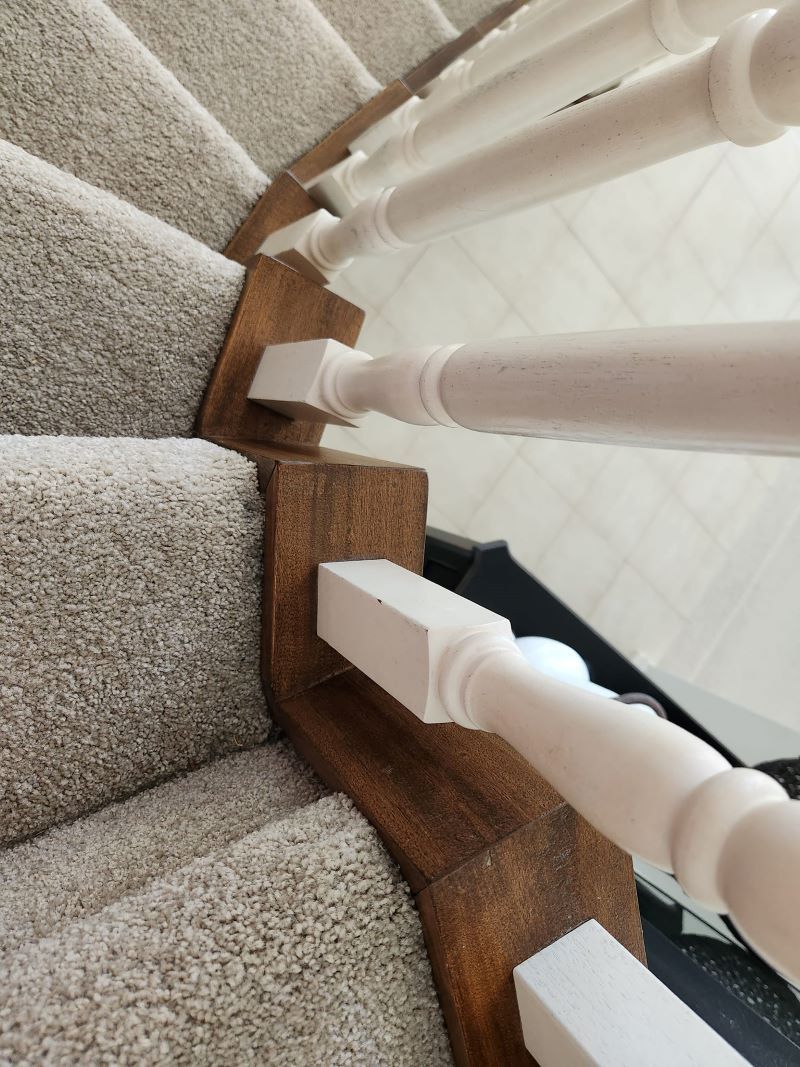 A Staircase with A Wooden Railing — KirraLina Cleaning Services in Tweed Heads, NSW