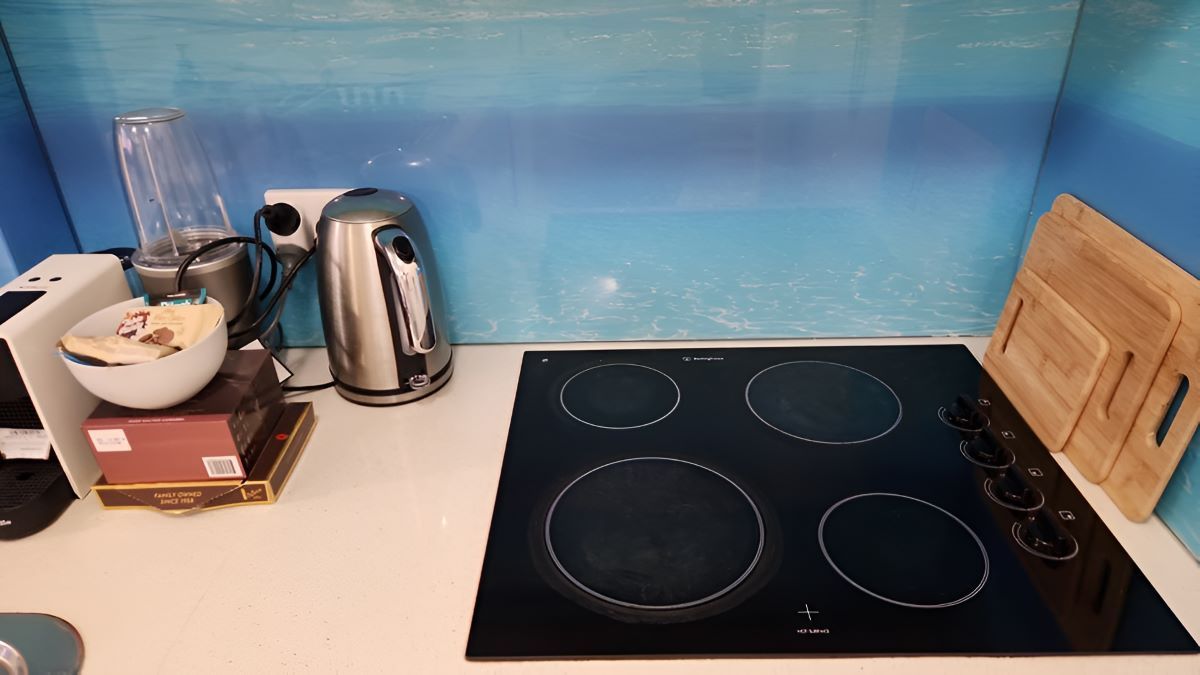 A Kitchen Counter with A Stove Top Oven — KirraLina Cleaning Services in Casuarina, NSW