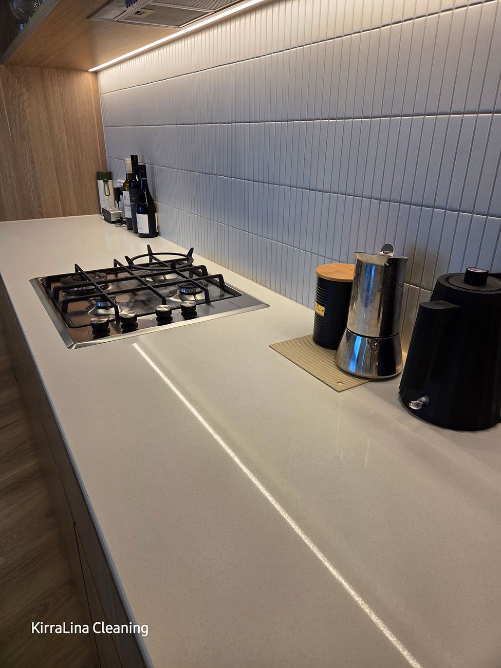 Kitchen Countertop with A Stovetop, Tiled Backsplash — KirraLina Cleaning Services in Tweed Heads, NSW