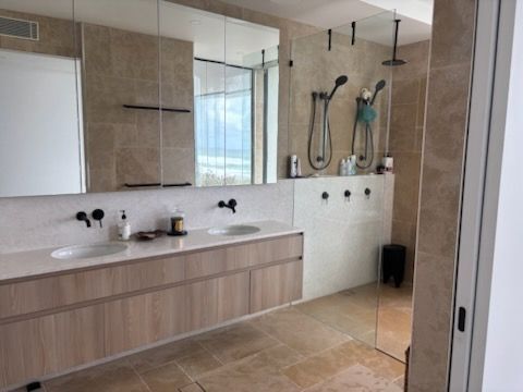 Spacious Bathroom with A Double Vanity, Walk-In Shower, and Neutral Color Palette — KirraLina Cleaning Services in Tweed Heads, NSW