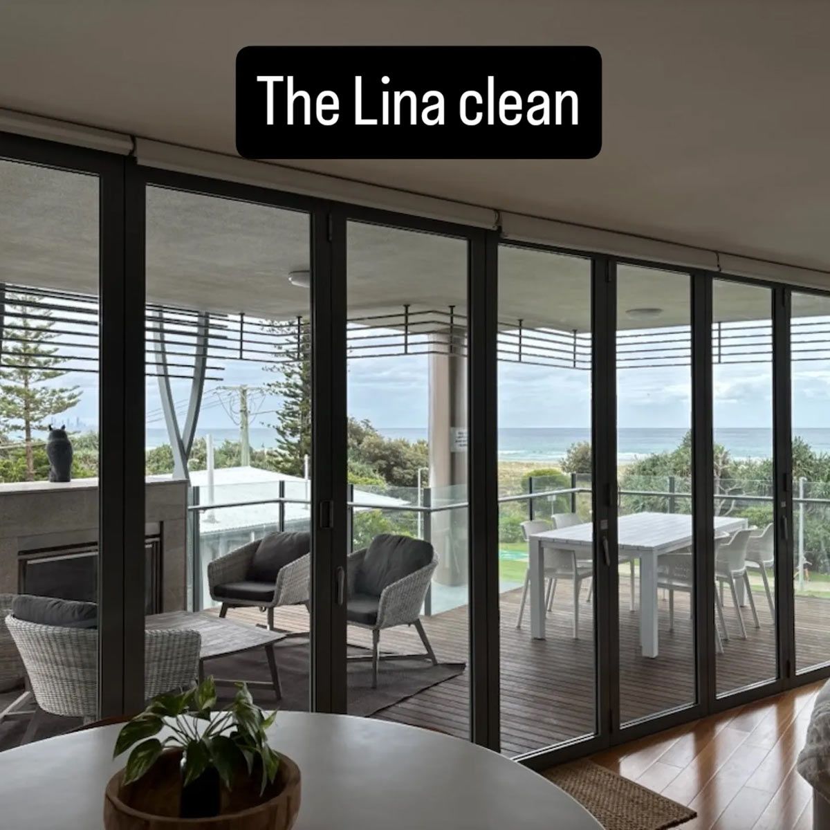 Glass Doors Frame an Ocean View from A Home's Interior — KirraLina Cleaning Services in Tweed Heads, NSW